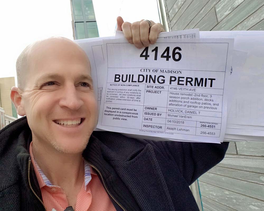 My hubby Dan proudly holding the permit… boy is he ever glad this part is over.