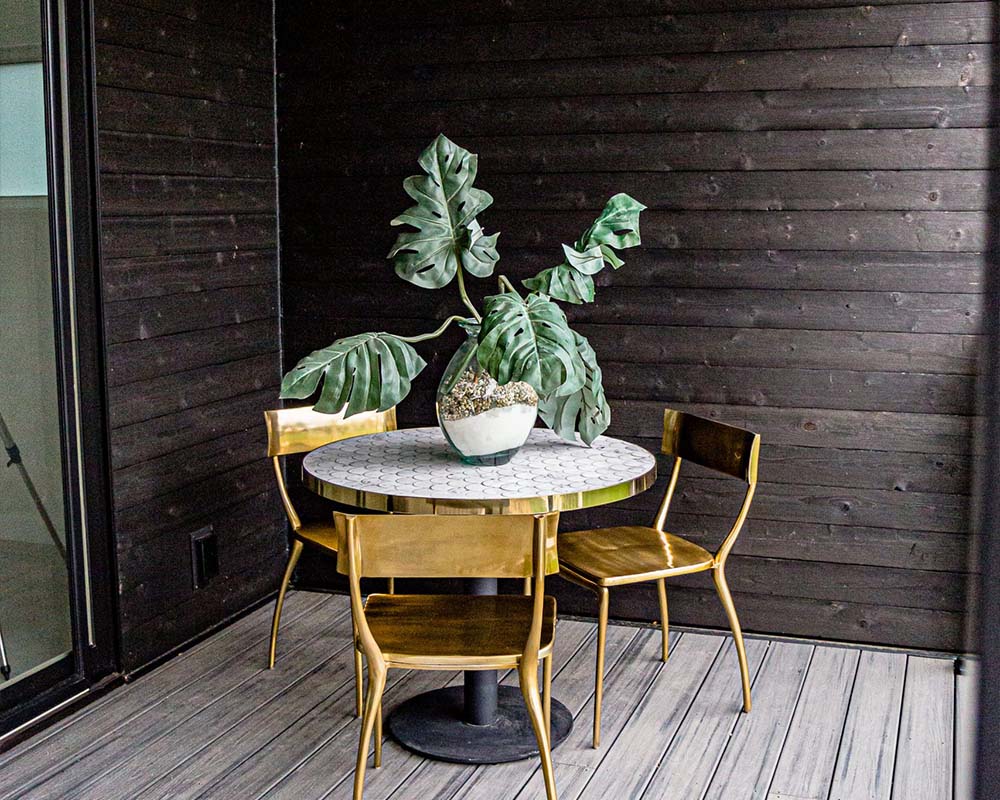 Gold chairs and white Carrara marble table from CB2