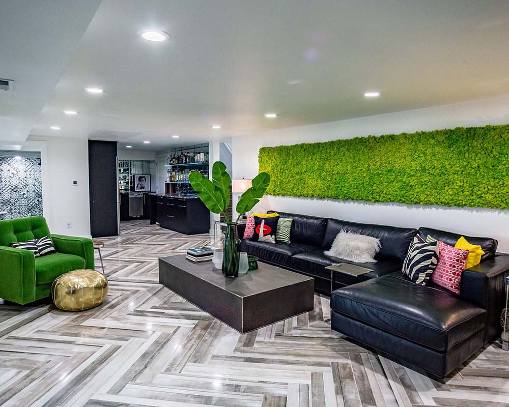 Hydra moss wall, Restoration Hardware leather sectional, RH shagreen coffee table and Urban Wood petrified look porcelain tile with Schluter heated floor mats.