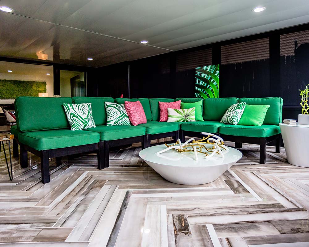 Marvin Multi Slide patio doors make this space open up to the rest of the lower level as they disappear into the wall.
