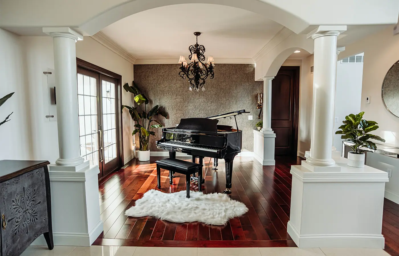 home entrance with grand piano and hardwood floors