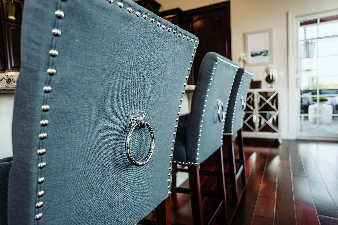 blue upholstered kitchen stools with silver rivets