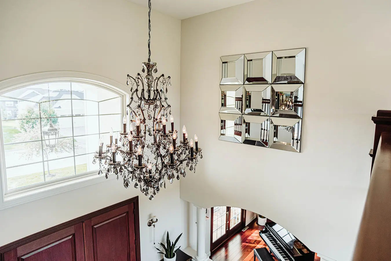 large chandelier with square mirror decor